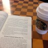 at Starbucks with a book "Word of Mouth Marketing"